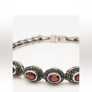 7” garnet and sterling silver bracelet.  Great condition